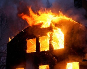 bigstock-Wooden-House-In-Flames-3324176-300x237[1]